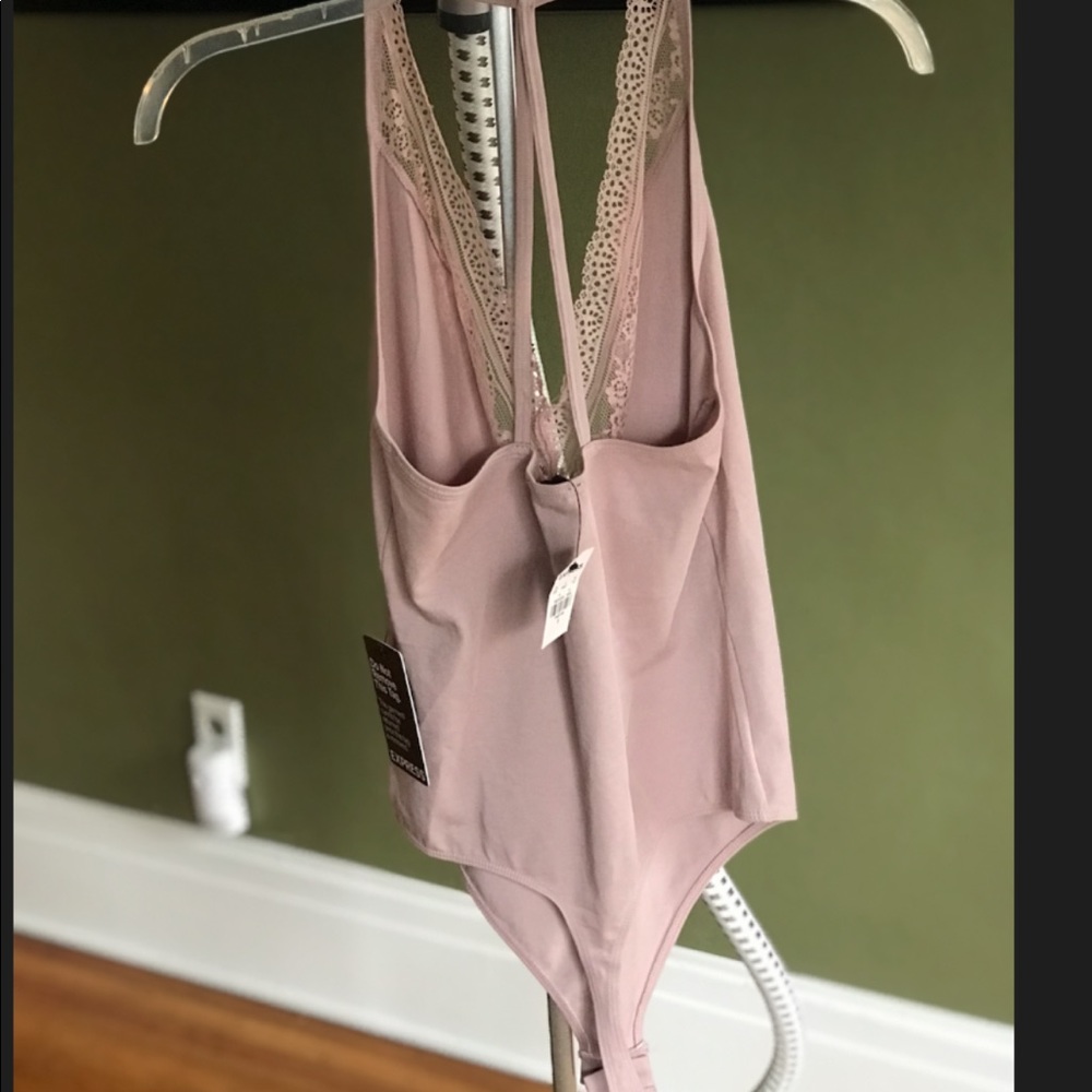 Pale pink body suit